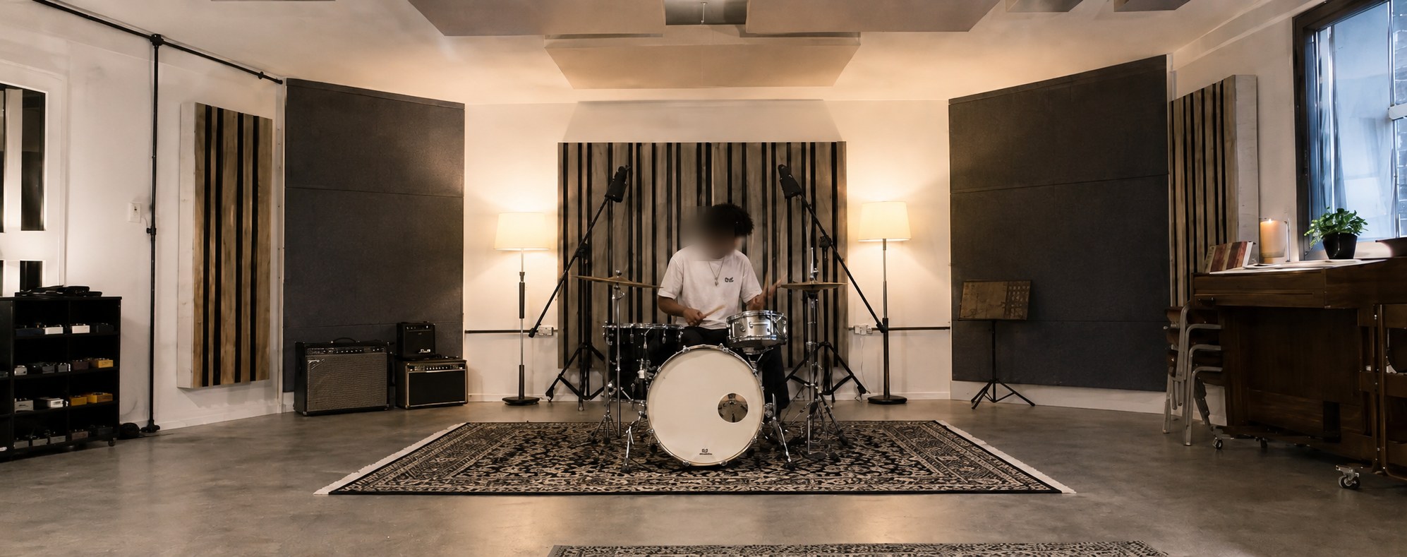 A drummer performing in the live room at Studio Solutions
